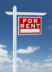 Image showing Right Facing For Rent Real Estate Sign on a Blue Sky with Clouds