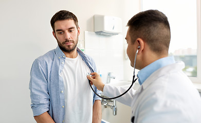 Image showing doctor with stethoscope and patient at hospital