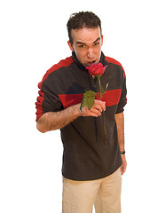 Image showing Man Smelling a Rose