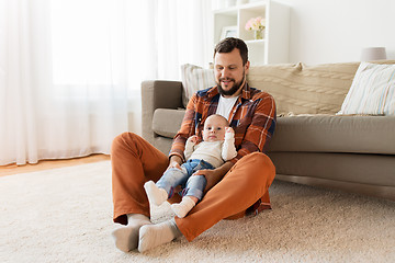 Image showing happy father with little baby boy at home