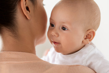 Image showing close up of happy little baby boy with mother