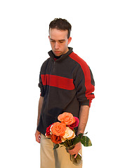 Image showing Male Holding a Vase of Flowers