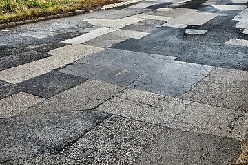 Image showing Patched broken road