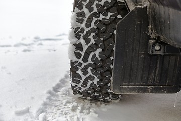 Image showing Car tyre in snow