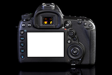 Image showing DSLR camera on black glass background