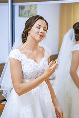 Image showing Bride getting ready for the wedding in the morning.