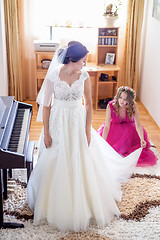 Image showing Beautiful young bride in wedding dress in living room