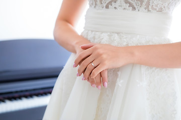 Image showing Engagement ring on bride’s finger