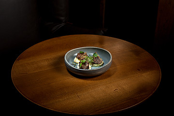 Image showing Grilled steak with vegetables puree on plate.