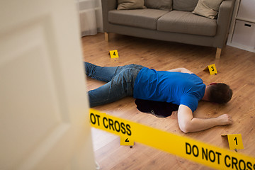 Image showing dead man body in blood on floor at crime scene