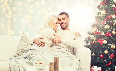 Image showing happy couple hugging over christmas tree