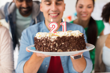 Image showing man with cake and friends at birthday party