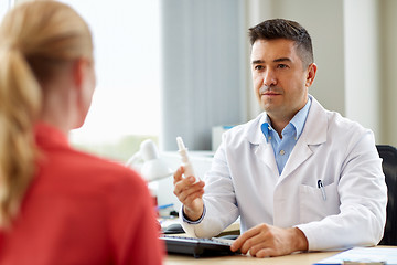 Image showing doctor with nasal spray and patient at hospital