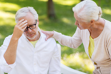 Image showing senior man suffering from headache outdoors