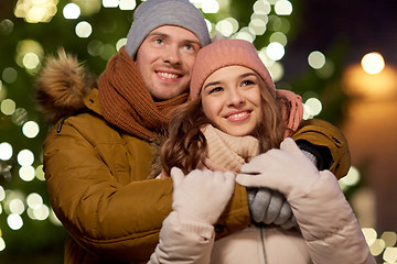 Image showing happy couple hugging at christmas tree