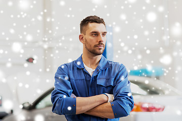 Image showing happy auto mechanic man or smith at car workshop