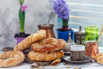 Image showing Turkish bagels with sesame seeds and coffee for breakfast.