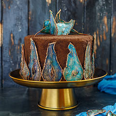 Image showing Chocolate cake with dried pears decoration.