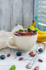 Image showing Chocolate smoothie bowl with cocoa beans.