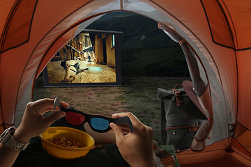 Image showing View from the tourist tent to the screen with a gangster movie