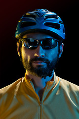 Image showing The bicyclist on black, studio shot.