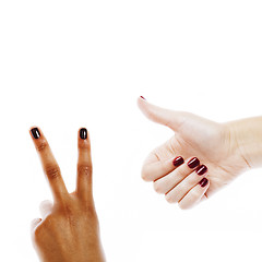 Image showing two different nathion manicured hands on white isolated