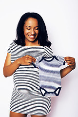 Image showing young pretty african american woman pregnant happy smiling, posing on white background isolated , lifestyle people concept copyspace 