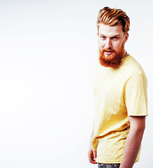 Image showing young handsome hipster ginger bearded guy looking brutal isolate