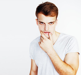 Image showing young handsome teenage hipster guy posing emotional, happy smiling against white background isolated, lifestyle people concept 