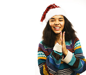 Image showing cute young girl in santas red hat isolated