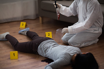 Image showing criminalist collecting crime scene evidence