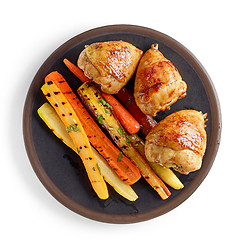 Image showing plate of grilled chicken legs and carrots