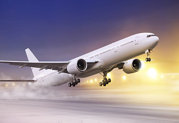 Image showing white plane in winter blizzard 