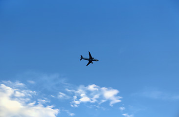 Image showing Airplane in the blue sky with clouds