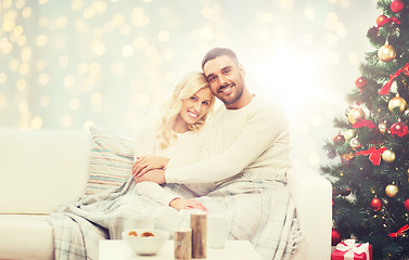 Image showing happy couple hugging over christmas tree