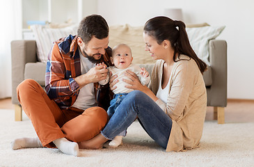 Image showing happy family with baby having fun at home