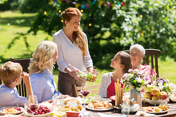 Image showing happy family having dinner or summer garden party