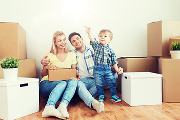 Image showing happy family with boxes moving to new home