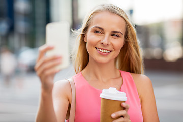 Image showing woman with coffee taking selfie by smartphone