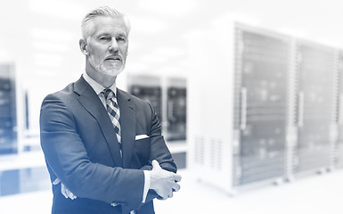 Image showing Senior businessman in server room