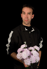 Image showing Man Holding Flowers Isolated on Black