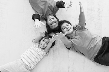 Image showing young boys having fun on the floor