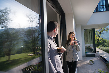 Image showing couple enjoying on the door of their luxury home villa