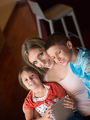 Image showing Young Family Using A Tablet To Make Future Plans