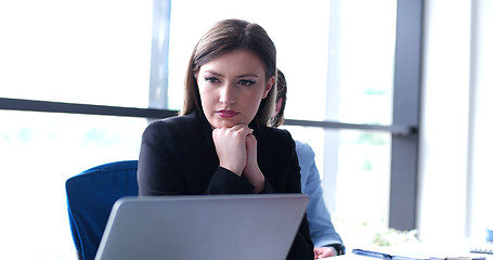 Image showing group of business people having a meeting in bright office