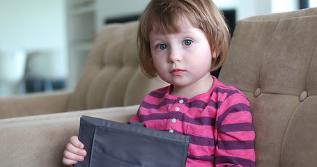 Image showing Child using tablet in modern apartment