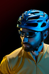 Image showing The bicyclist on black, studio shot.