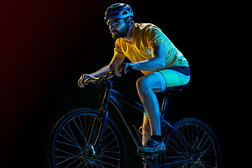 Image showing The bicyclist on black, studio shot.