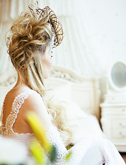 Image showing beauty young bride alone in luxury vintage interior with a lot o