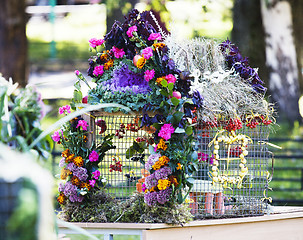 Image showing picture of bright decorated with flowers bird house